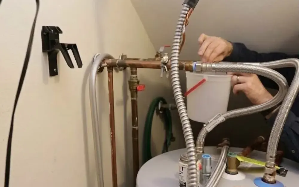 Flexible water heater connector hoses attached to copper lines